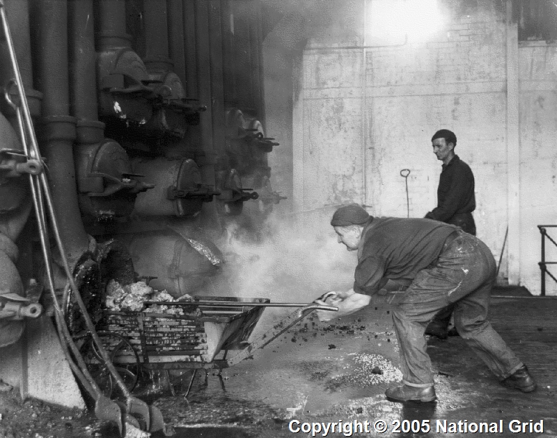 Photograph of stokers and workers in retort house at Grange-over-Sands